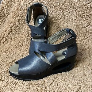 Fly London cross strap wedge with hole cutout in heel. Women’s 11/42 NWOT